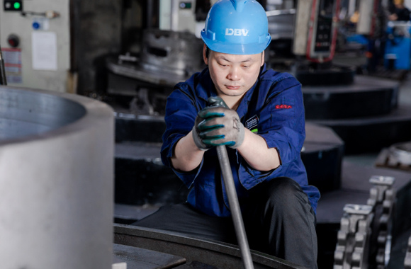 bombor's worker repairing the machine